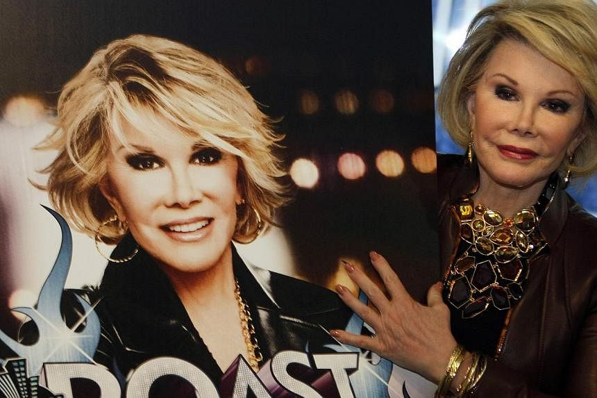 Joan Rivers posing for photographers as she presents Comedy Roast With Joan Rivers at the annual Mipcom television programme market in Cannes, south-eastern France, in 2009. -- PHOTO: REUTERS