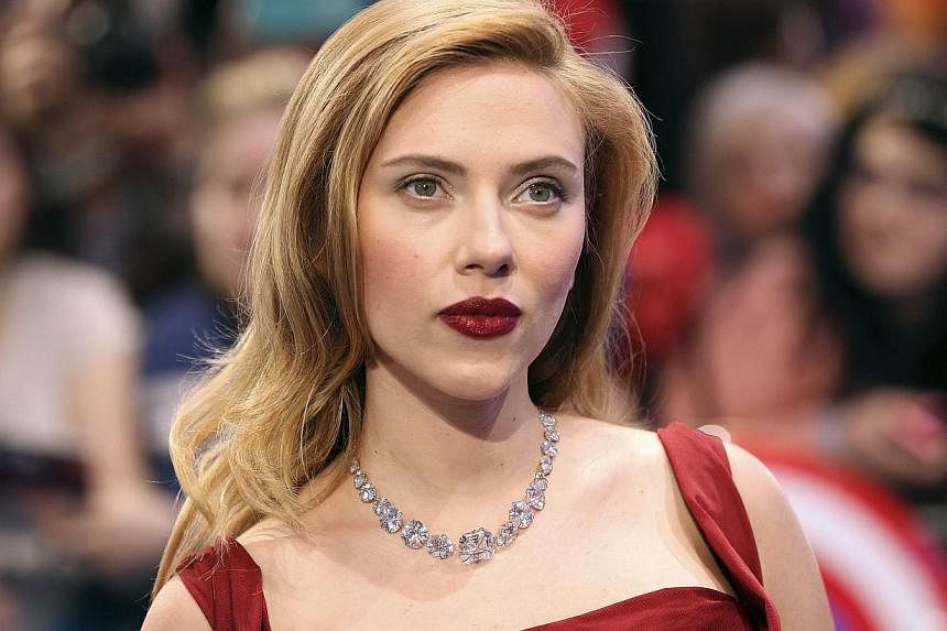 Actress Scarlett Johansson arrives at the UK premiere of Captain America: The Winter Soldier in London on March 20, 2014. Johansson has given birth to a baby girl with her French fiance Romain Dauriac, her spokesman said on Thursday. -- PHOTO: REUTER