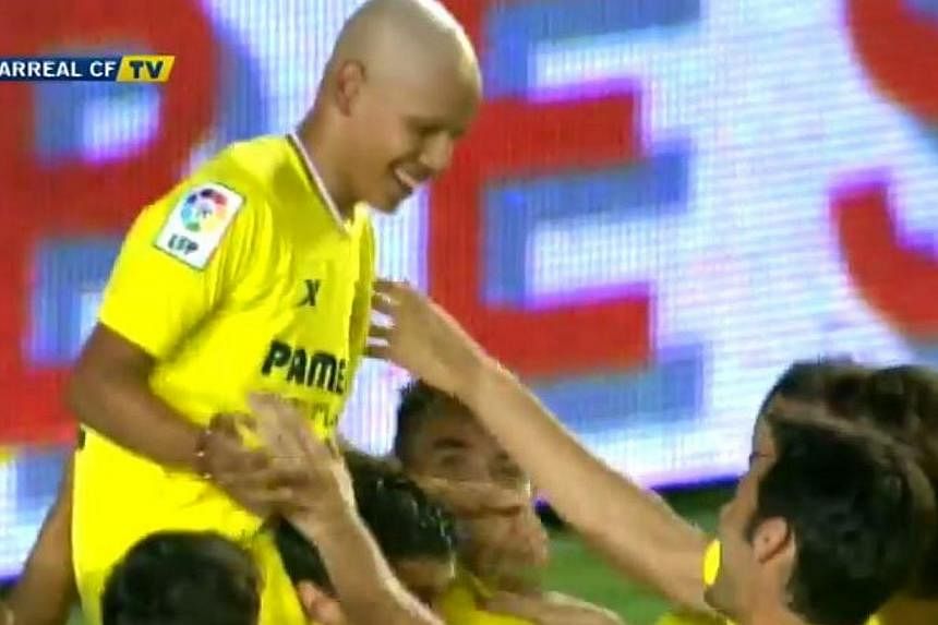 Villarreal fan Gohan, who is battling cancer, is mobbed by his teammates after he scores against Celtic in a friendly match. -- PHOTO: VILLARREAL CF/YOUTUBE