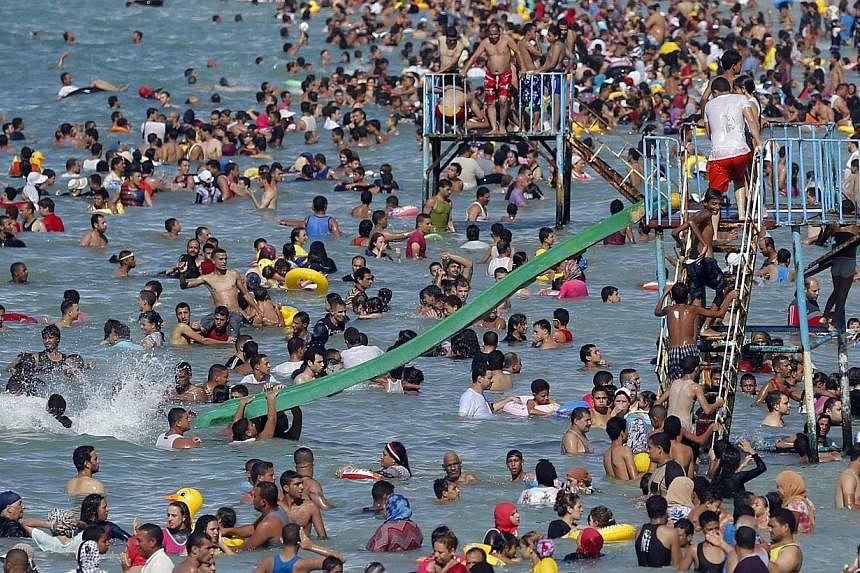 Egyptians crowd a public beach during a hot day nearing the end of summer vacation for schools, in the Mediterranean city of Alexandria, 230 km north of Cairo on Sept 5, 2014.&nbsp;Egypt's President Abdel Fattah al-Sisi urged Egyptians on Saturday to
