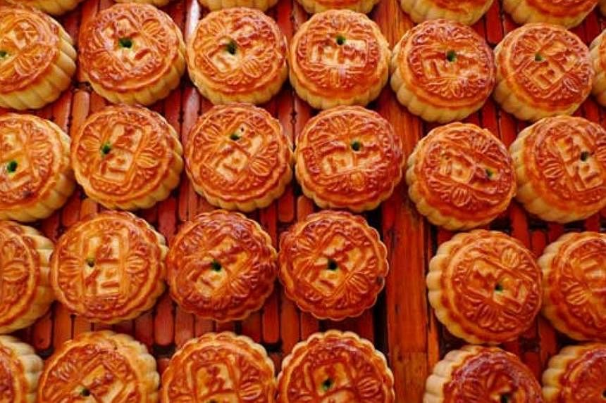 Sales of mooncakes in Guangdong province have plummeted after the country's top anti-graft body banned the use of public funds to purchase the Mid-Autumn Festival delicacy. -- PHOTO:&nbsp;CHINA DAILY/ASIA NEWS NETWORK&nbsp;