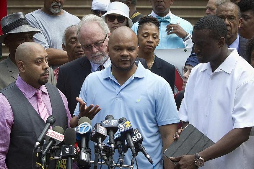 (Front, from left)&nbsp;Wrongly convicted "Central Park Five" members Raymond Santana, Kevin Richardson and Yusef Salaam attend a news conference announcing the payout for the case at City Hall in New York on June 27, 2014.&nbsp;A US federal judge ha