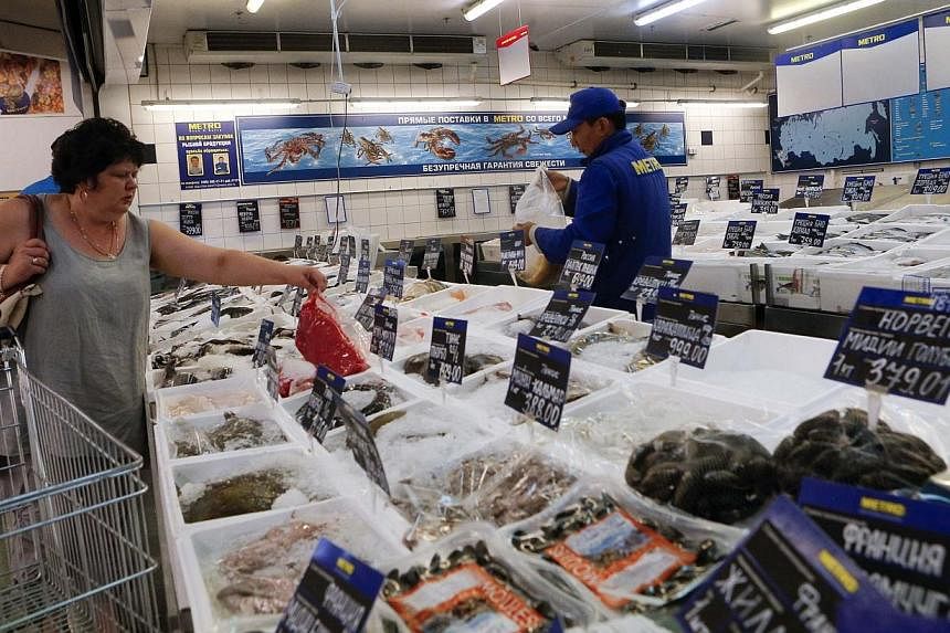 Seafood is on sale at a Metro Cash and Carry store in Moscow on Aug 8, 2014.&nbsp;Russia warned on Saturday, Sept 6, 2014, that it would react if the European Union imposed fresh economic sanctions against it over the situation in Ukraine. -- PHOTO: 