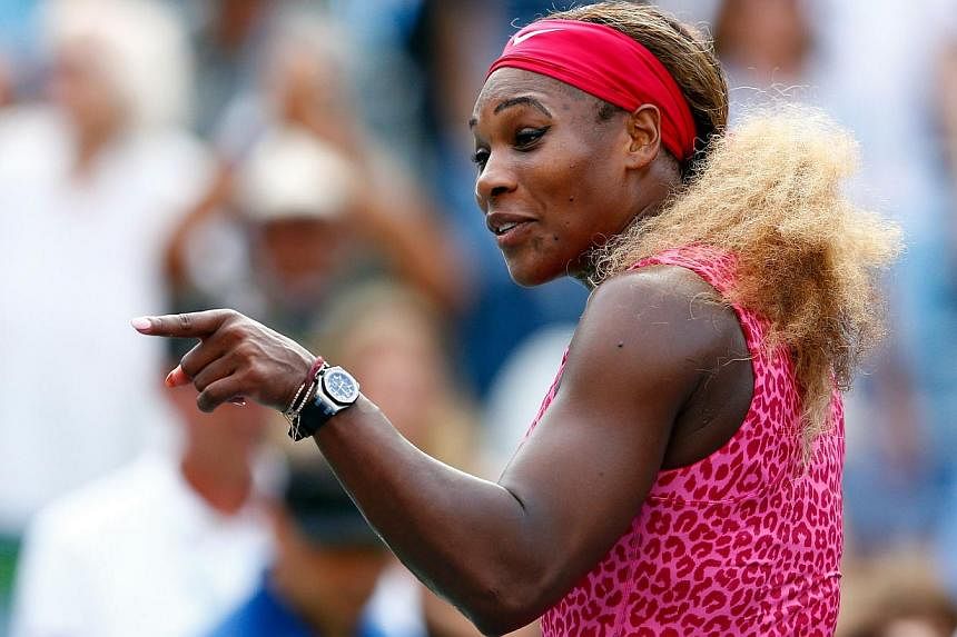 Serena Williams of the United States celebrates after defeating Ekaterina Makarova of Russia during their women's singles semifinal match on Day Twelve of the 2014 US Open at the USTA Billie Jean King National Tennis Center on Sept 5, 2014 in the Flu