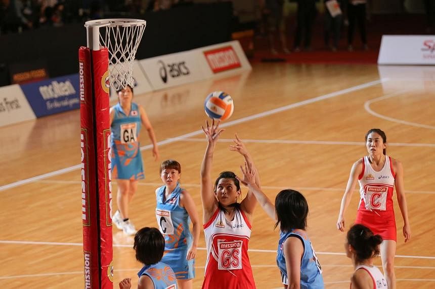 The Singapore national netball team began the defence of their Mission Foods Asian Netball Championships with a resounding 67-13 victory over Group A opponents Japan on Sunday. -- ST PHOTO: ONG WEE JIN