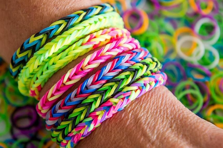 Tens of thousands of the original Rainbow Loom kit, which retails at $29.90 and is made in China, have been sold in Singapore. --&nbsp;PHOTO: AFP