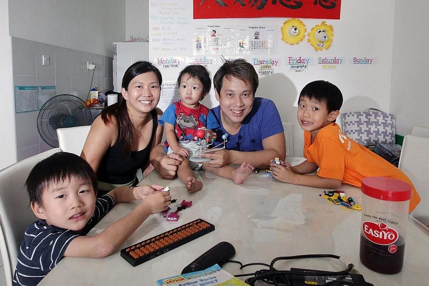 Magician Derrick Lee, 36, and his wife Mrs Sophia Lee, 34, homeschool their three children Prince Ranen Lee, 7, Jethro Wise Lee, 5, and Asher Noah Lee, 2. -- ST PHOTO: NEO XIAOBIN