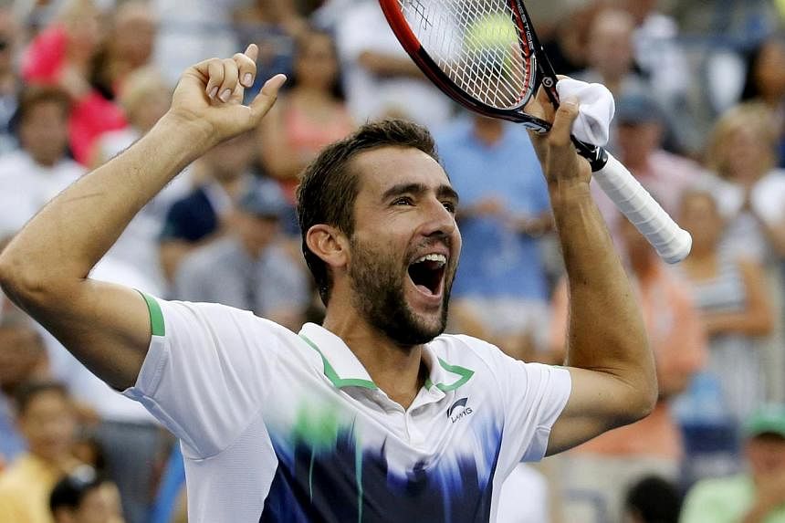 Marin Cilic of Croatia celebrates after defeating Roger Federer of Switzerland in their semi-final match at the 2014 US Open tennis tournament in New York, on Sept 6, 2014. -- PHOTO: REUTERS