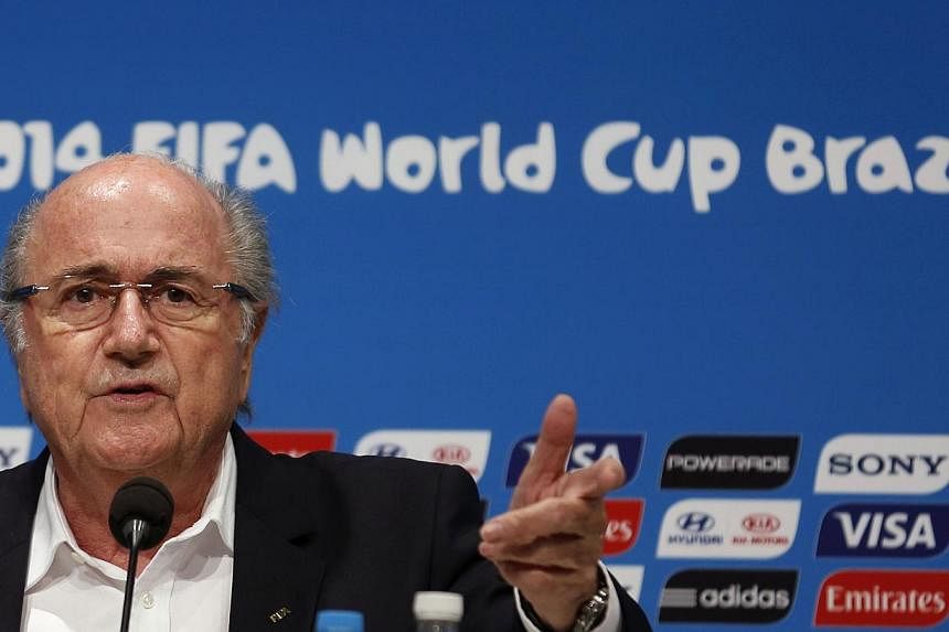 Fifa President Sepp Blatter speaks during a news conference at the Maracana stadium in Rio de Janeiro on July 14, 2014.&nbsp;Mr Blatter will stand for re-election as Fifa president next year, he confirmed on Monday, Sept 8, 2014. -- PHOTO: REUTERS