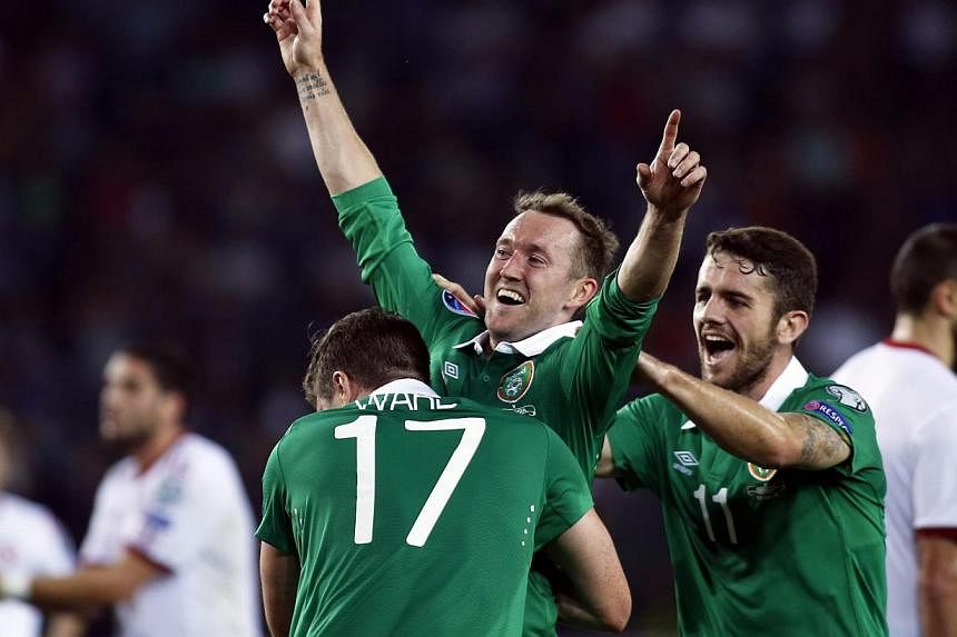 Ireland's Aiden McGeady (centre) celebrates with his teammates after scoring against Georgia during their Euro 2016 Group D qualifying soccer match in Tbilisi on Sept 7, 2014. -- PHOTO: REUTERS