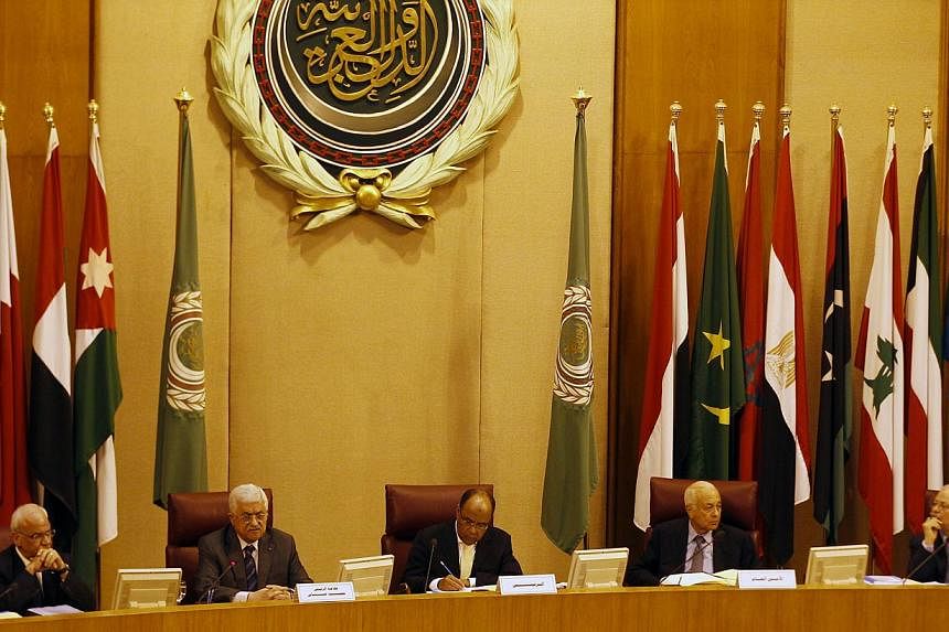 Foreign ministers of the Arab League take part in an emergency meeting at the league's headquarters in Cairo on Sept 7, 2014. -- PHOTO: REUTERS