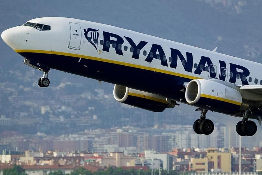 In this file picture taken on Sept 1, 2010 an airplane of the Irish low-cost airline Ryanair takes off from Barcelona's airport. -- PHOTO: AFP
