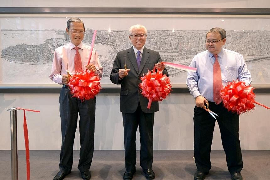 (From left) Singapore Press Holdings chairman Lee Boon Yang, President Tony Tan Keng Yam and Urban Redevelopment Authority chairman Peter Ho at the ribbon-cutting ceremony. -- ST PHOTO: LIM SIN THAI