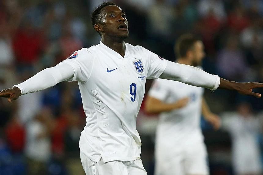 England's Danny Welbeck celebrates his second goal against Switzerland during their Euro 2016 qualifying soccer match at the Sankt Jakob-Park stadium in Basel on Sept 8, 2014. -- PHOTO: REUTERS
