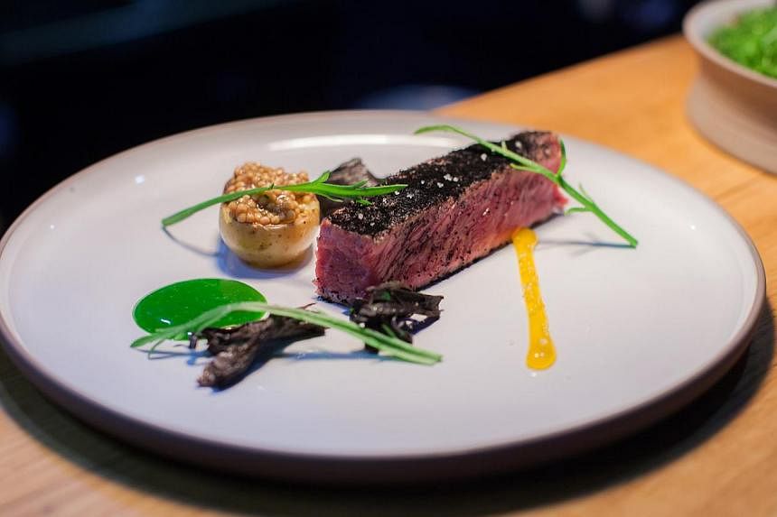 Beef short rib cooked in black tea and served with watercress (above). -- PHOTO: PORTE 12