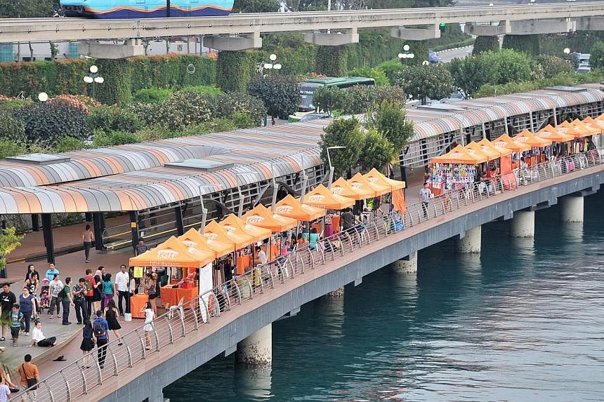 Currently, riders going to Sentosa have to filter into fast-moving car lanes at the end of the Sentosa Causeway Bridge, next to the Sentosa Boardwalk (above).&nbsp;-- PHOTO: ST FILE
