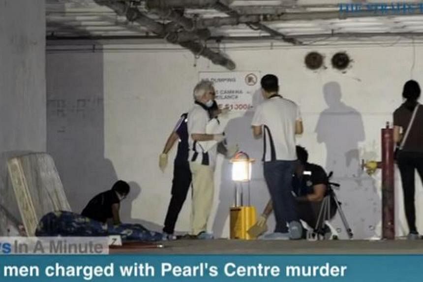 In today's The Straits Times News In A Minute video, two Malaysian men were charged with the murder of another Malaysian at the multi-storey carpark in Pearl's Centre. -- PHOTO: SCREENGRAB FROM RAZORTV VIDEO&nbsp;