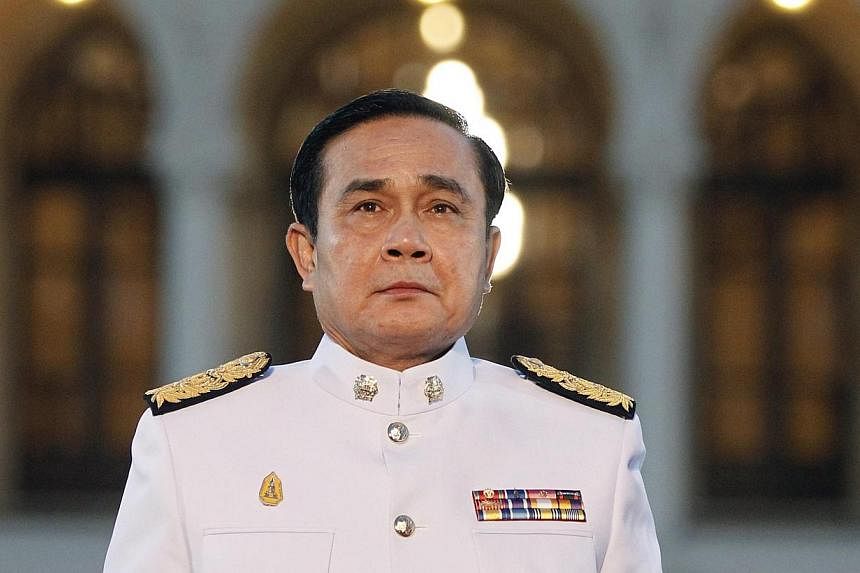 Thai Prime Minister Prayuth Chan-ocha, like most Thais, has a deep respect for the spirit world. -- PHOTO: REUTERS