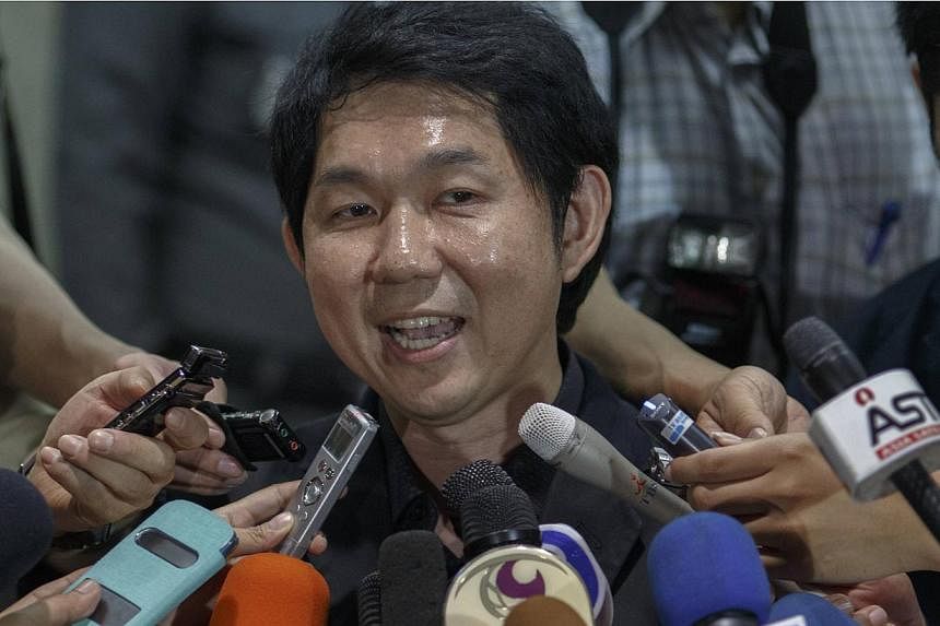 Pisit Tantiwattanakul,&nbsp;owner of the clinic at the centre of a surrogacy scandal in Thailand, reported to the police on Tuesday but denied all the allegations against him.&nbsp;-- PHOTO: REUTERS
