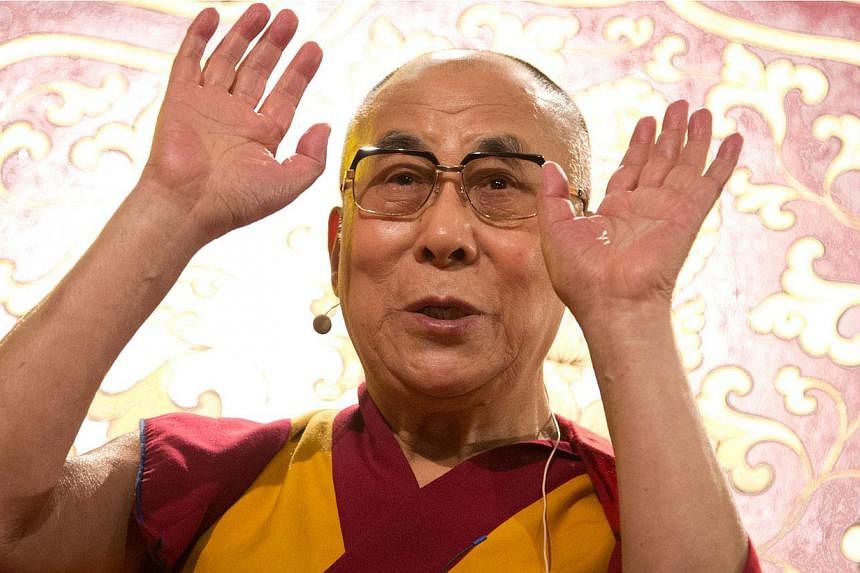 Tibetan spiritual leader Dalai Lama gestures during a ceremony in Hamburg, northern Germany, on Aug 26, 2014.&nbsp;China repeated a call on the Dalai Lama on Wednesday, Sept 10, to respect what it said was the historic practice of reincarnation, afte