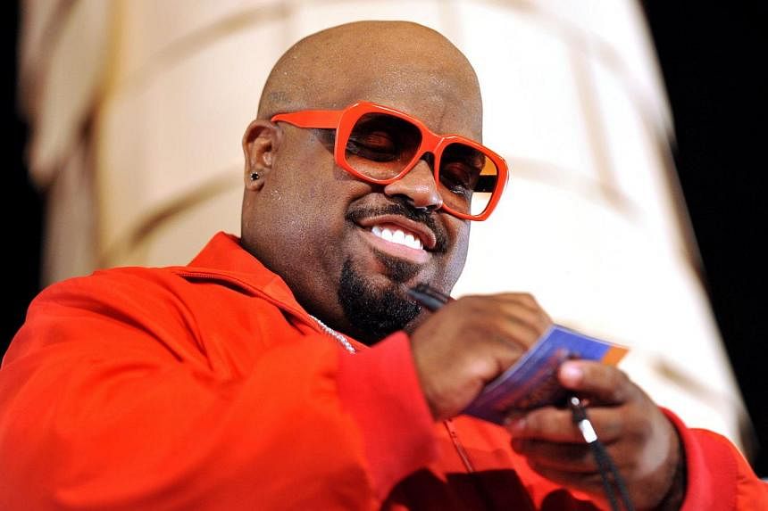 Singer Cee Lo Green as he signs autographs at an M&amp;M’s pretzel promotion in New York on 2011. Cee Lo Green has been dropped from his last remaining performance dates as outrage builds over the R&amp;B star's treatment of a woman and subsequent 