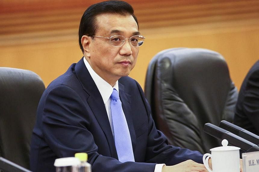 Chinese Premier Li Keqiang on Wednesday, Sept 10, 2014, vowed no leniency for corporate lawbreakers whether domestic or foreign, as Beijing pursues a high-profile anti-monopoly crackdown. -- PHOTO: AFP