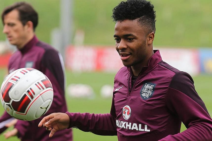 England's midfielder Raheem Sterling in action during a team training session at St George's Park in central England, on Sept 5, 2014. -- PHOTO: AFP