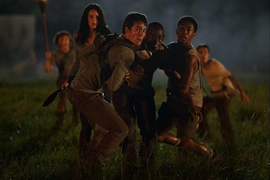 The lack of romance in The Maze Runner, which stars (foreground, from left) Dylan O'Brien, Aml Ameen and Jacob Latimore, works to its advantage.