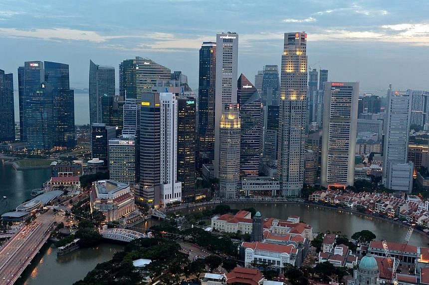 Economists have become less optimistic about Singapore's growth prospects for this year, after the economy expanded at a lower-than-expected rate in the April to June quarter. -- PHOTO: ST FILE