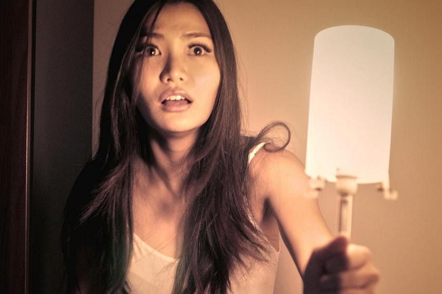&nbsp;Local model-actress Melissa Faith Yeo stars in local production Afterimages as Amy Tan, who witnesses a suicide and takes a photo of the victim. -- PHOTO:&nbsp;MYTHOPOLIS PICTURES AND CATHAY-KERIS FILMS