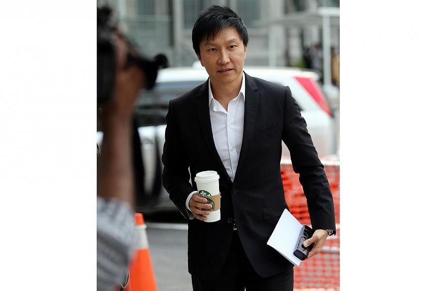 City Harvest Church (CHC) founder Kong Hee at the courts on Sept 11, 2014. Kong choked up a few times on the stand on Thursday as he told the court how investigations into financial irregularities at the church had affected his young son. -- ST PHOTO