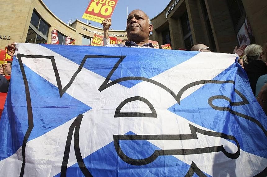 A "Yes" campaign supporter tries to disrupt a "No" campaign rally in Glasgow on Sept 11, 2014.&nbsp;The International Monetary Fund said on Thursday that a vote by citizens of Scotland for independence could raise many questions and upset markets in 