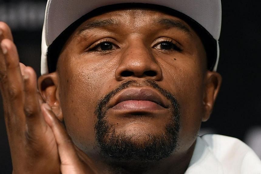 Floyd Mayweather (pictured) apologised on Wednesday for his comments on the Ray Rice fiasco, adding he does not agree with comparisons between his domestic problems and those of the suspended National Football League player. -- PHOTO: AFP