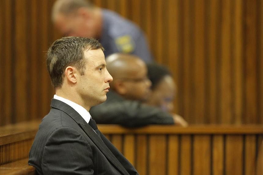 "Blade Runner" Oscar Pistorius sat weeping in the dock on Thursday as a judge began handing down the verdict over the Valentine's Day killing of the star Paralympian's model lover. -- PHOTO: AFP