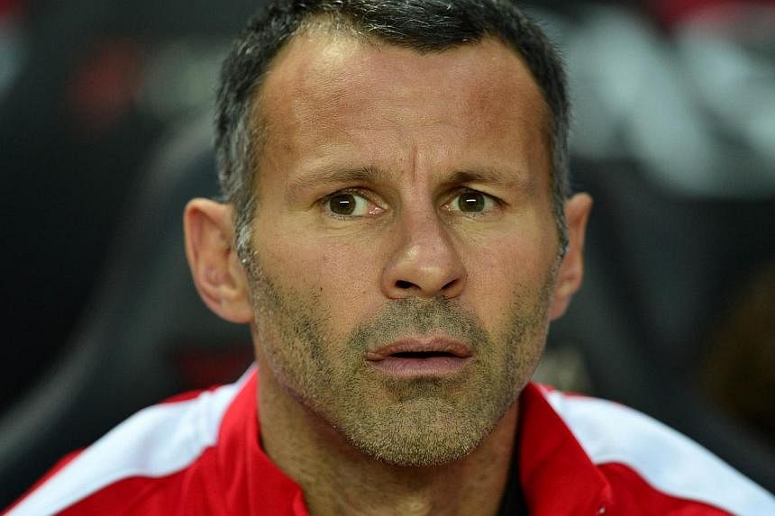 Ryan Giggs reassured Manchester United fans on Wednesday, Sept 10, 2014, that the club's commitment to youth development remains intact. -- PHOTO: AFP