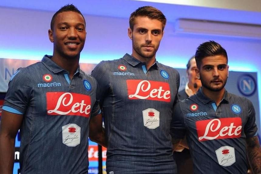 Apart from Jonathan De Guzman on the left, the players don't seem enthused by their new denim-styled kit. -- PHOTO: NAPOLI/TWITTER
