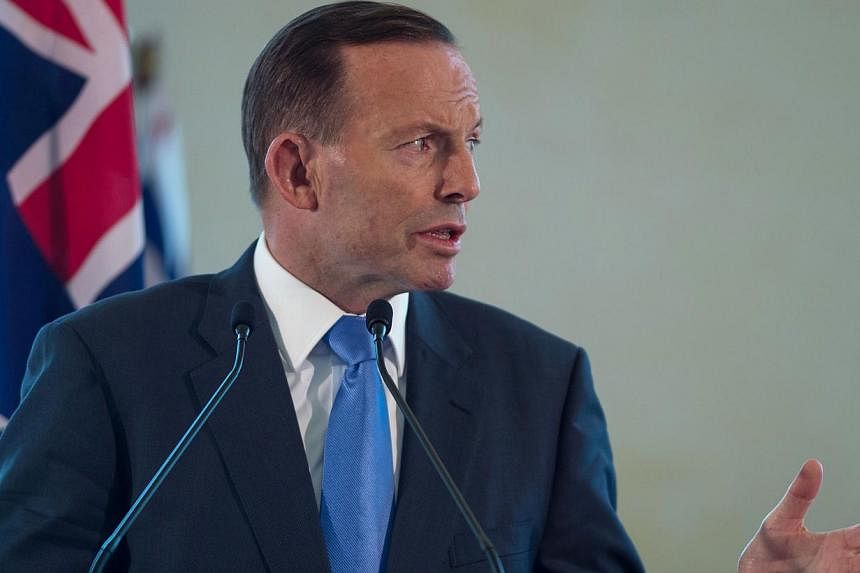 Australian Prime Minister Tony Abbott speaks during a joint press conference at the prime minister's office in Putrajaya, outside Kuala Lumpur on September 6, 2014. Amid fresh concerns about Australians returning from the Middle East, the country has