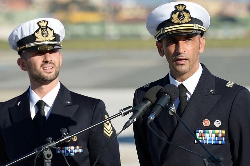 Italian marines Massimiliano Latorre (right) and Salvatore Girone (left) speak to the press at Ciampino Airport near Rome.&nbsp;India's top court ruled on Friday that a sick Italian marine detained for the 2012 killing of two fishermen can go home fo