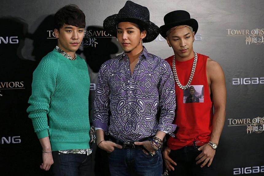 Members of K-Pop idol group BigBang (from left) Seungri, G-Dragon and Taeyang attend a news conference in Hong Kong on July 29, 2014.&nbsp;Seungri was reported to have been involved in a car accident early on Friday morning. -- PHOTO: REUTERS