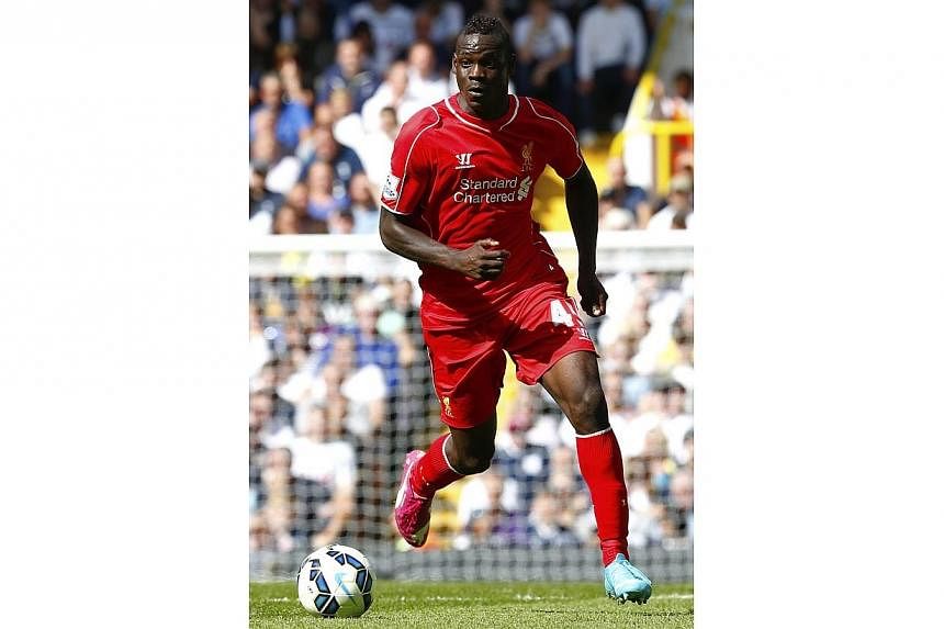 Liverpool's Mario Balotelli runs with the ball during their English Premier League soccer match against Tottenham Hotspur at White Hart Lane in London on Aug 31, 2014.&nbsp;Mario Balotelli will be available for Liverpool's home Premier League match a