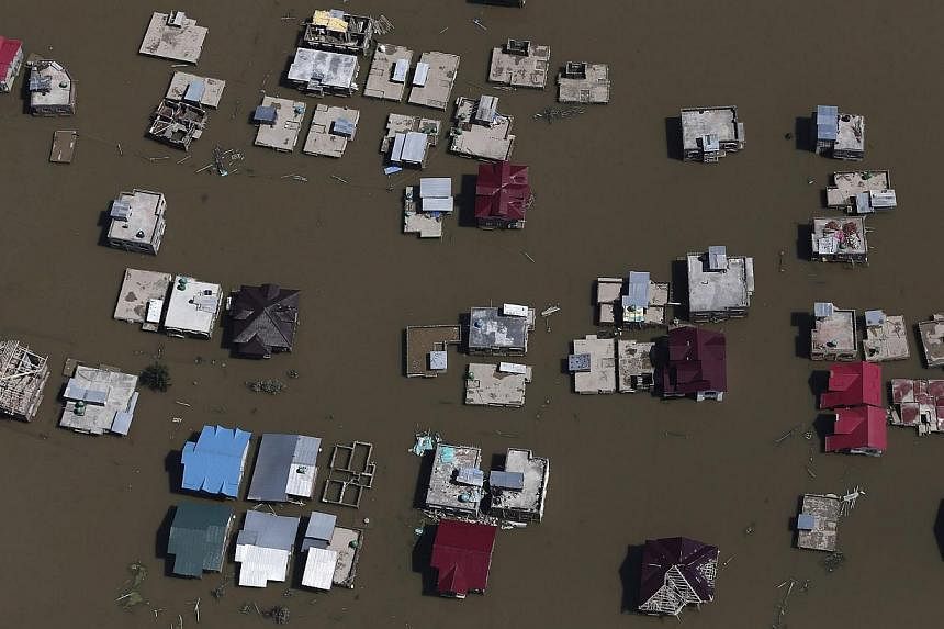 An aerial view shows flooded houses and streets in Srinagar on Sept 11, 2014.&nbsp;The main city in Indian Kashmir has "drowned completely" under floodwaters, a senior official said on Friday, with the deadly inundation now affecting about two millio
