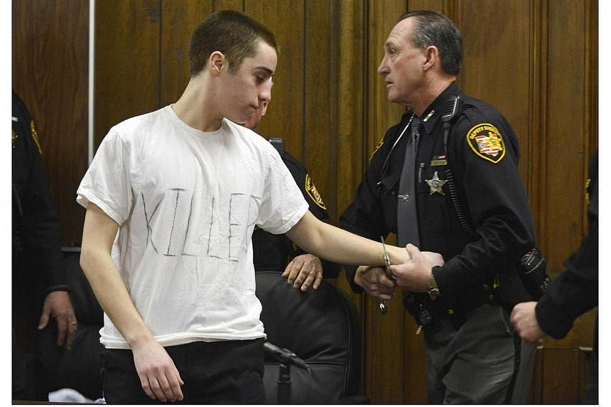 T.J. Lane is handcuffed by a sheriff's deputy after sentencing in Cleveland, Ohio, in this file photo from March 19, 2013. -- PHOTO: REUTERS