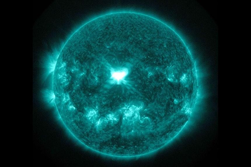 An X1.6 class solar flare flashes in the middle of the sun in this image taken Sept 10, 2014, in this image courtesy of Nasa.&nbsp;Two big explosions on the surface of the sun will cause a moderate to strong geomagnetic storm on Earth in the coming d