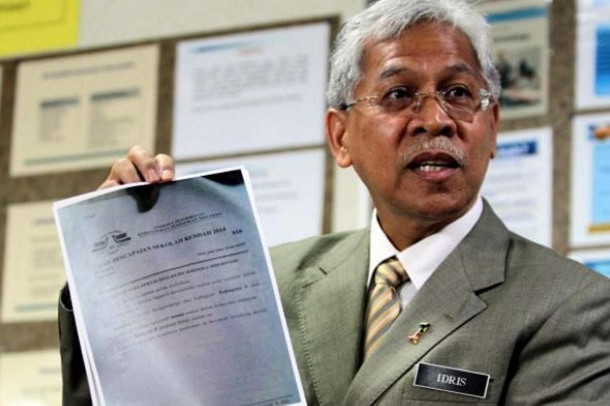 Malaysia's Second Education Minister Datuk Seri Idris Jusoh speaking at a press conference at the Malaysian Examinations Syndicate in Putrajaya on Friday. -- PHOTO: THE STAR/ASIA NEWS NETWORK&nbsp;