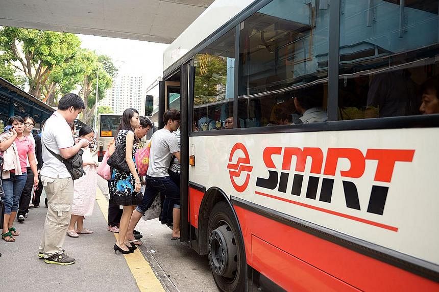 Commuters boarding an SMRT bus near Clementi MRT station.&nbsp;Transport operator SMRT Corp and the Employment and Employability Institute (e2i) have tied up to launch the first integrated career programme for bus drivers. -- PHOTO: ST FILE