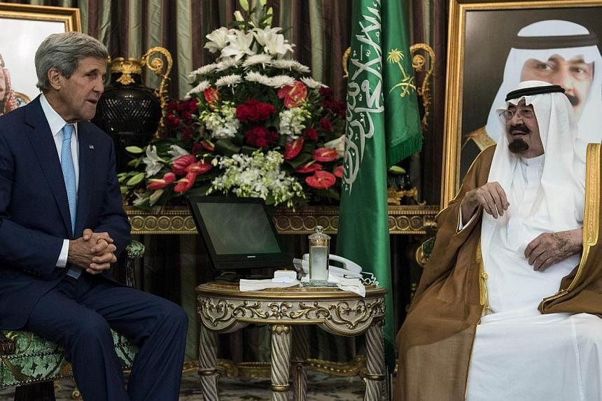 Saudi King Abdullah bin Abdul Aziz al-Saud (R) and US Secretary of State John Kerry talk before a meeting at the Royal Palace on September 11, 2014 in Jeddah, Saudi Arabia. Kerry and regional counterparts have started talks in Saudi Arabia on forming