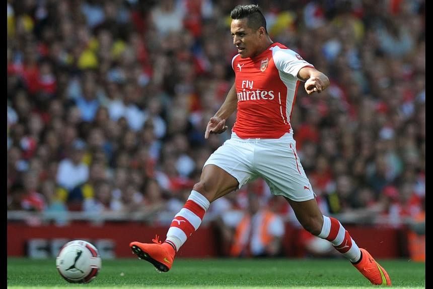 Arsenal's Alexis Sanchez in action for the English club in the Emirates Cup pre-season tournament against AS Monaco. -- PHOTO: AFP