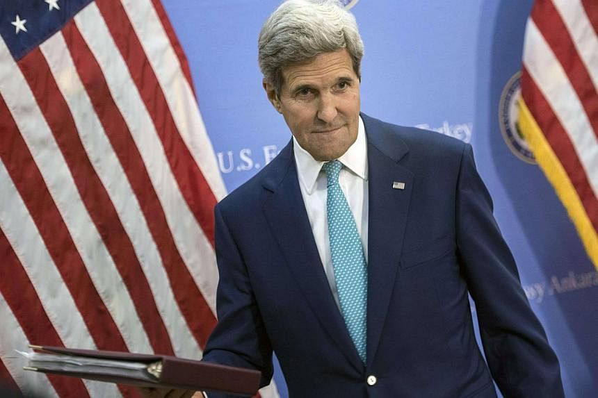 US Secretary of State John Kerry leaves after a news conference in Ankara on Sept 12, 2014. -- PHOTO: REUTERS