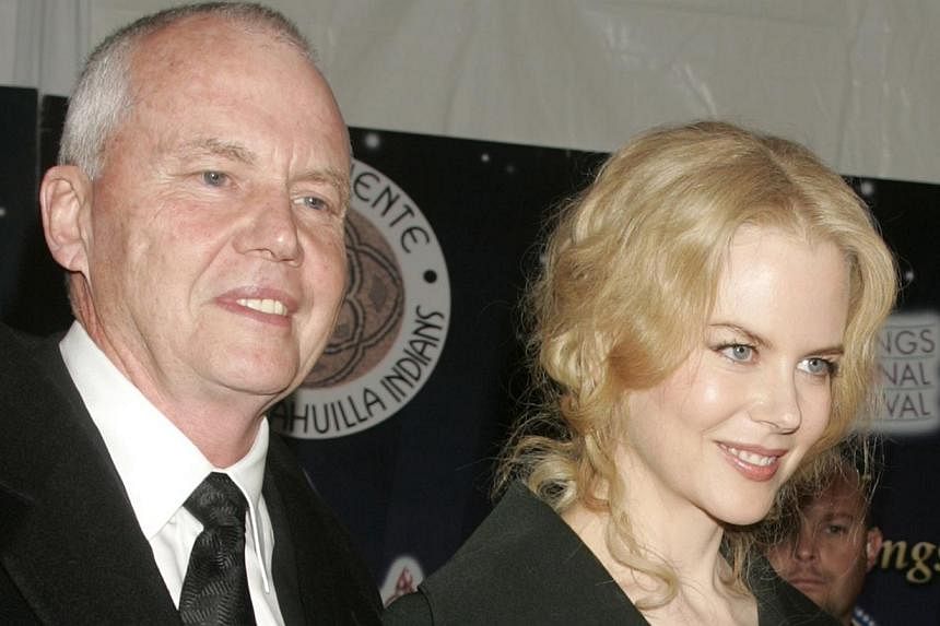 Actress Nicole Kidman is escorted by her father, Dr. Antony Kidman, as she arrives at the 2005 Palm Springs Film Festival Gala dinner in Palm Springs, California, in 2005. -- PHOTO: REUTERS