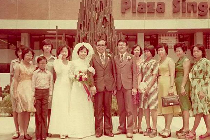 Hong Kong's one-Michelin-star restaurant Tim Ho Wan opened an outlet (above) at The Atrium@Orchard in April last year and draws queues for its dim sum. Groom Hsien Yong Seng (seventh from left) in a 1975 wedding picture taken outside Plaza Singapura.